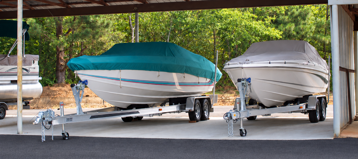 Two boats parked in covered storage spaces at ADMA